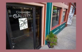 Photo of the Cooperative Gallery 213 logo on the front door