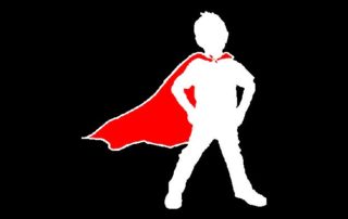 White outline of a child wearing a red cape on a black backgorund